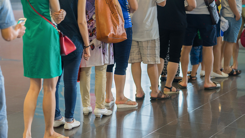 A group of people waiting in line in Singapore